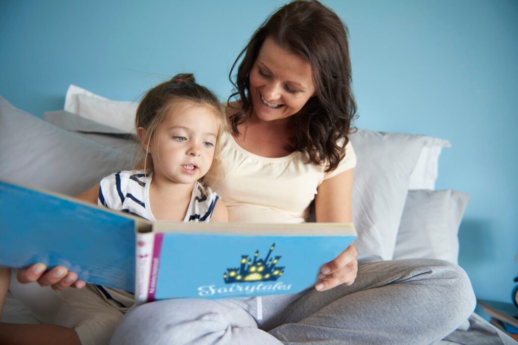 Mom and daughter reading a book