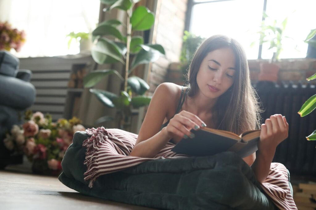 Girl reading a book at home